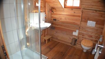 Shower, hair dryer, soap, toilet paper