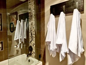 Bathtub, hair dryer, towels, soap
