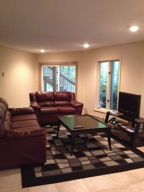 Additional Family Room on ground level, complete with air hockey table