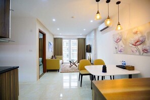 City Apartment | Living area | 50-inch flat-screen TV with digital channels, TV