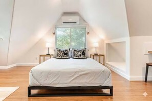 1 bedroom, desk, iron/ironing board, travel crib