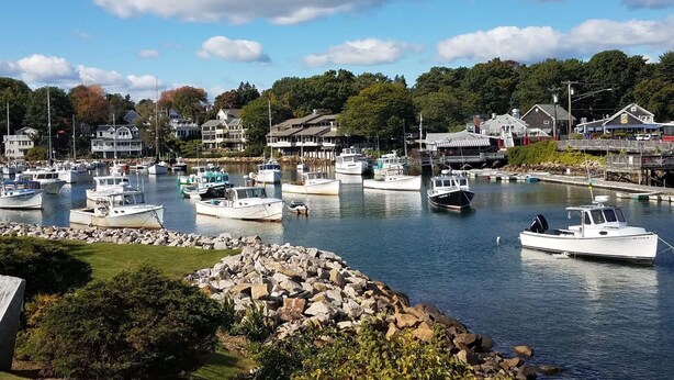 A marina with multiple boats docked, surrounded by residential buildings and greenery. - Relax and get away! Beautiful beach house, close to OGT Village and Beach  (Ogunquit)