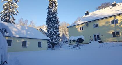 Apartment near the forest with a large garden with playground and fire pit