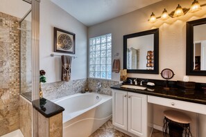 Combined shower/bathtub, hair dryer, towels, soap