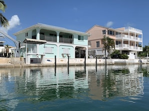 View from canal; 80ft seawall; step-down seawall for easy access to boat; Pool