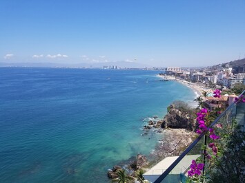 Sweeping panoramic blue ocean and Banderas Bay view from terrace