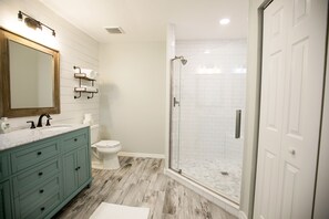 Bathtub, towels, soap, toilet paper