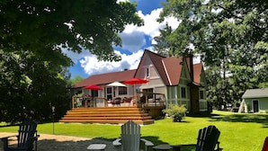 A house with a deck, outdoor seating, and a fire pit. - Truly a slice of heaven a must see! (Innisfil)