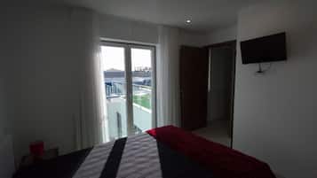 Apartamento, 1 quarto | 1 quarto, cortinas blackout, ferros/tábuas de passar roupa