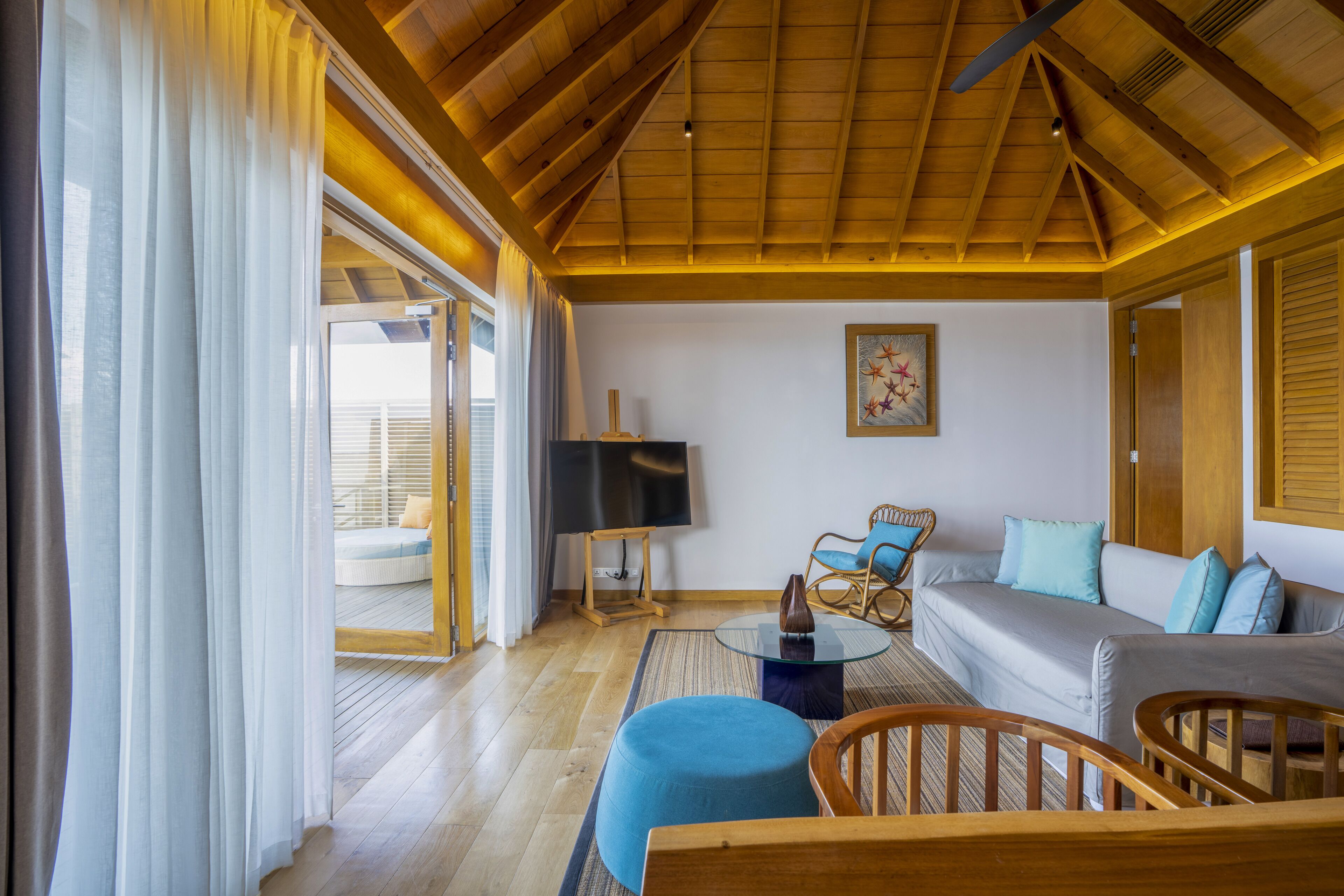 superior water villa with pool | living area | 55-inch flat-screen tv with cable channels, tv, ipod dock