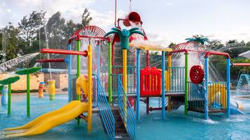 A water park with various play structures, slides, and water features.