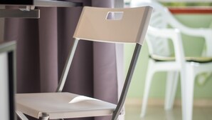 A modern room with a foldable chair, a table, and a view of the outdoors. - Incredible Relax Studio with Mountain Views and High Speed WIFI (Puerto de la Cruz)