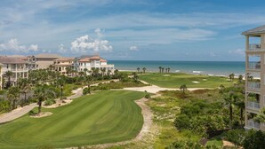 A golf course with a view of the ocean and beachfront properties. - Beachy Keen Platinum Property with Unbeatable View!   (Palm Coast)