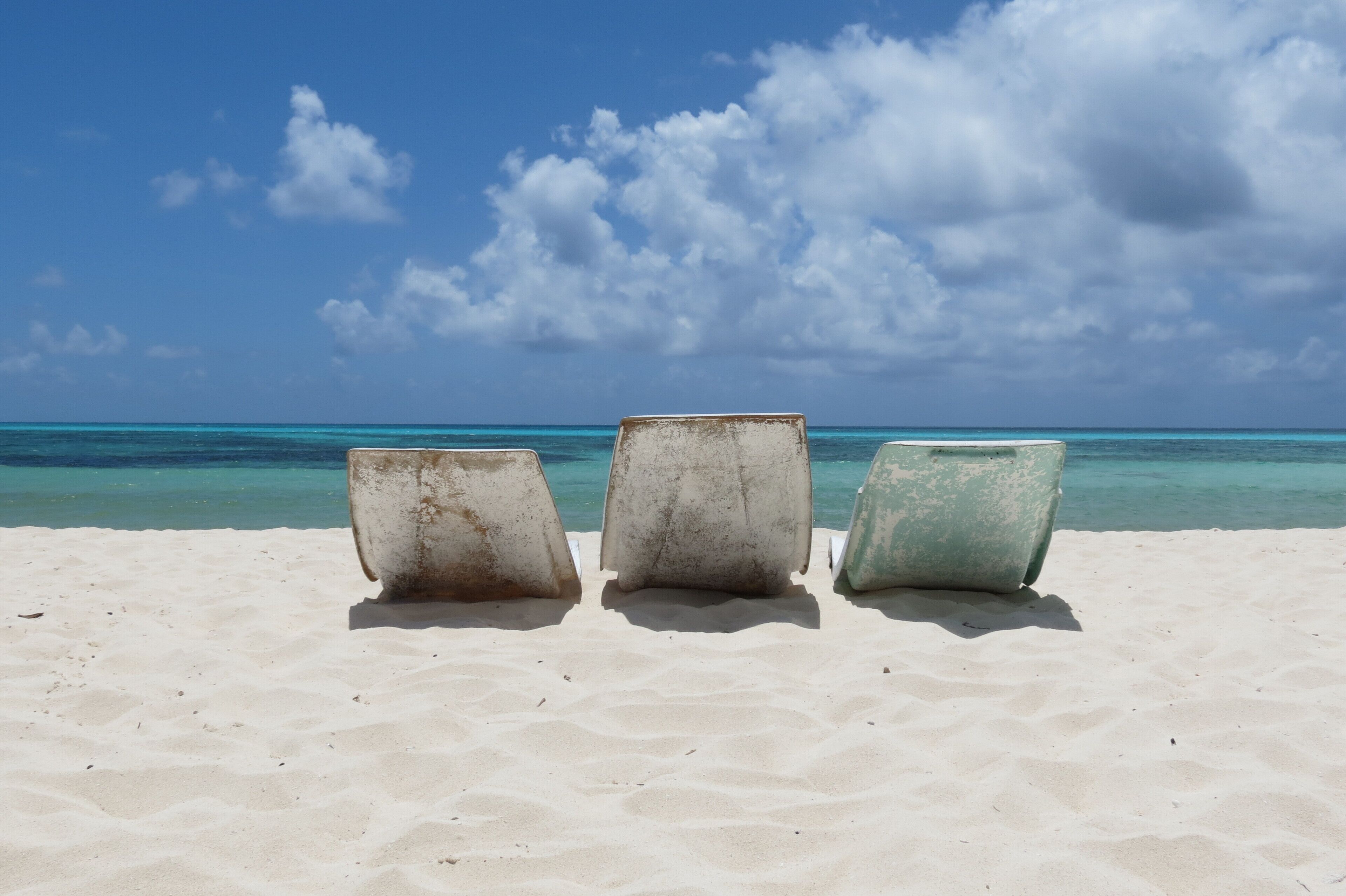 On the beach, sun loungers, beach towels