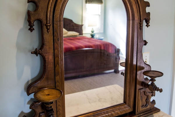 19th Century hand carved dresser with marble top and adjustable mirror.