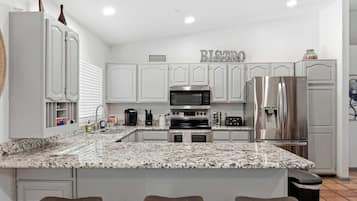 Coffee/tea maker, fridge, microwave, oven