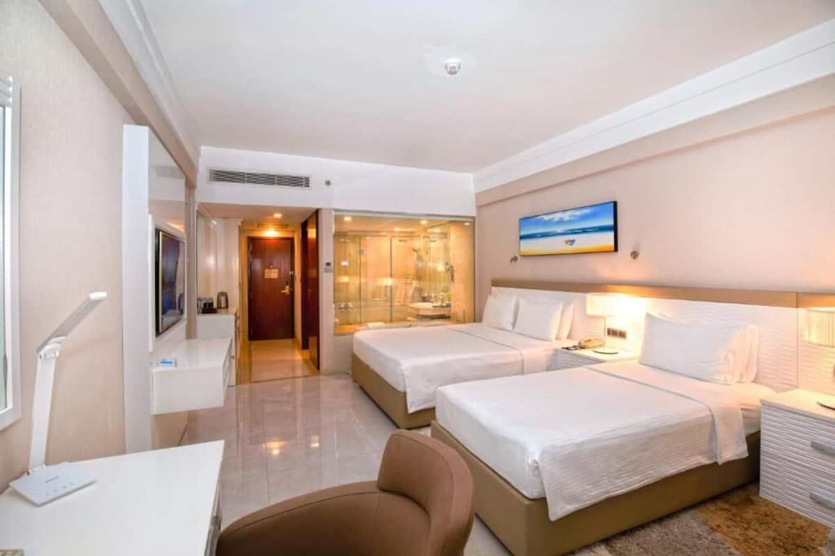 Premier King Room - Triple with Complimentary City Tour & Access to Beach Lounge | Bathroom | Separate tub and shower, deep soaking tub, rainfall showerhead