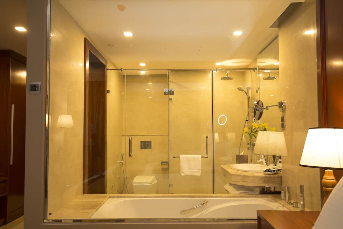 separate bathtub and shower, deep-soaking bathtub, rainfall showerhead