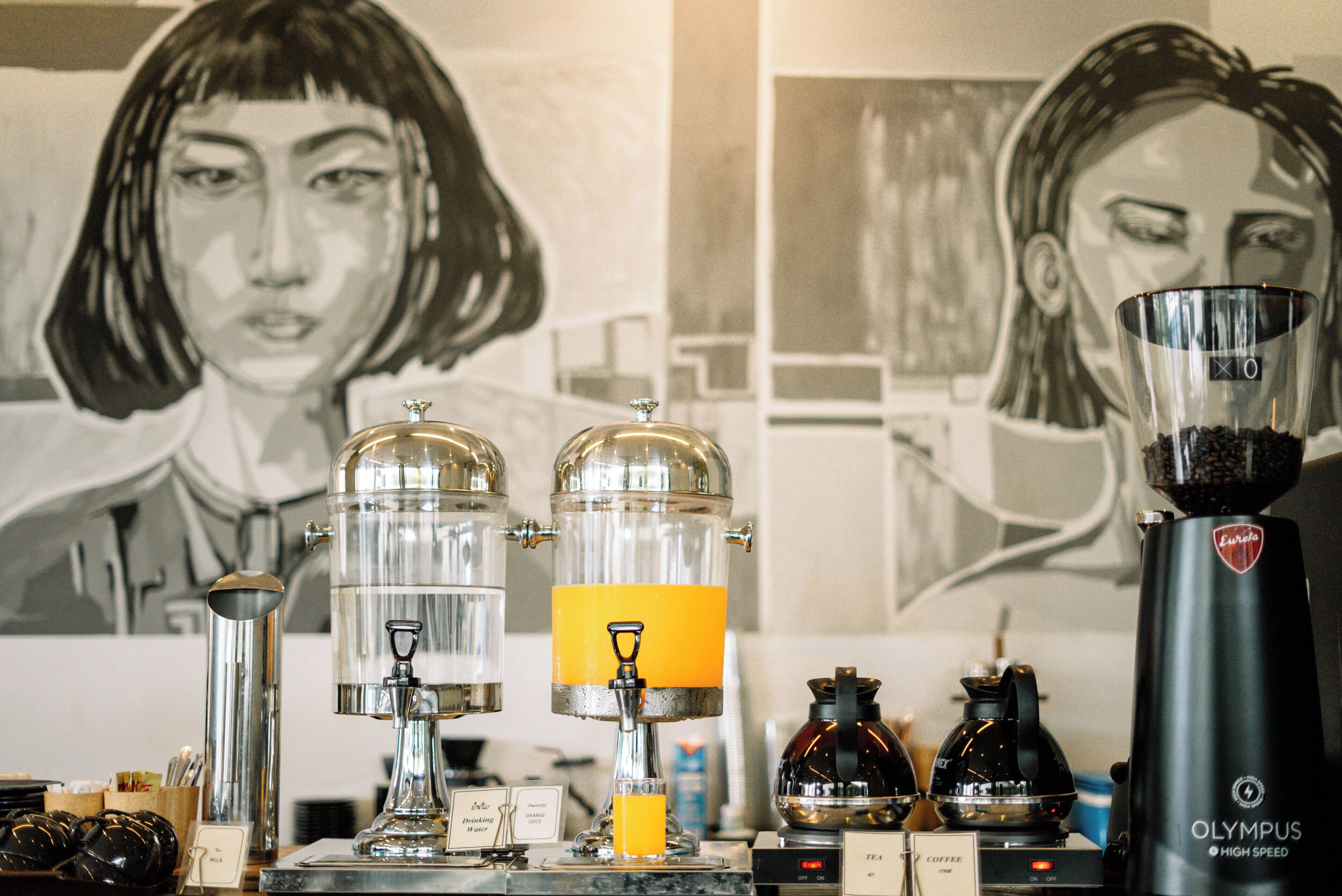 A coffee machine and a water dispenser on a counter.