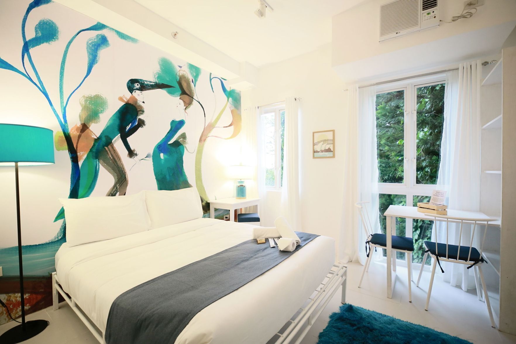 Desk, laptop workspace, bed sheets, wheelchair access
