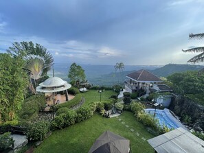 A luxurious villa with a private pool, lush garden, and panoramic mountain views. - The Lakeview Suites  (Tagaytay)
