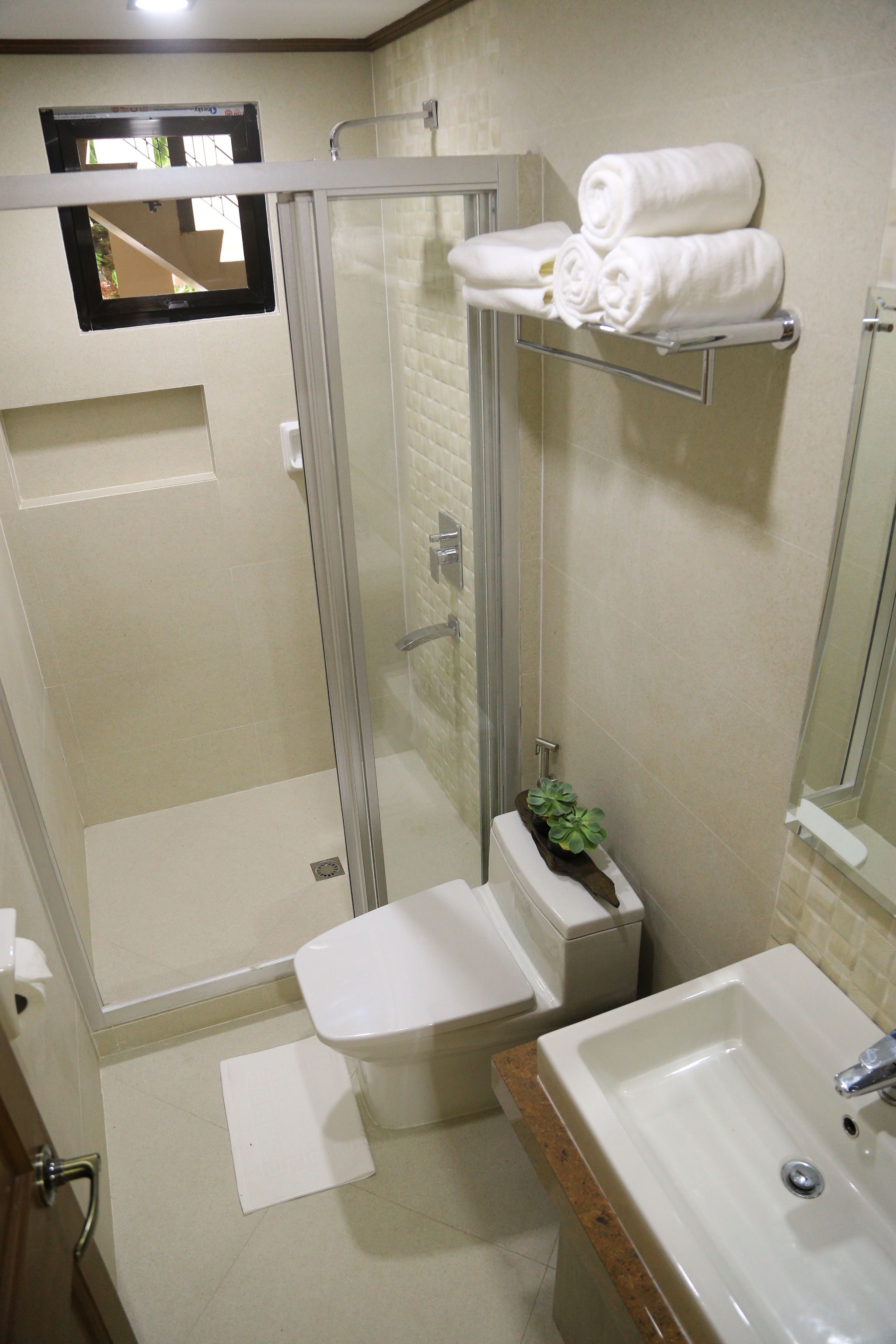 family studio suite | bathroom | shower, free toiletries, slippers, bidet
