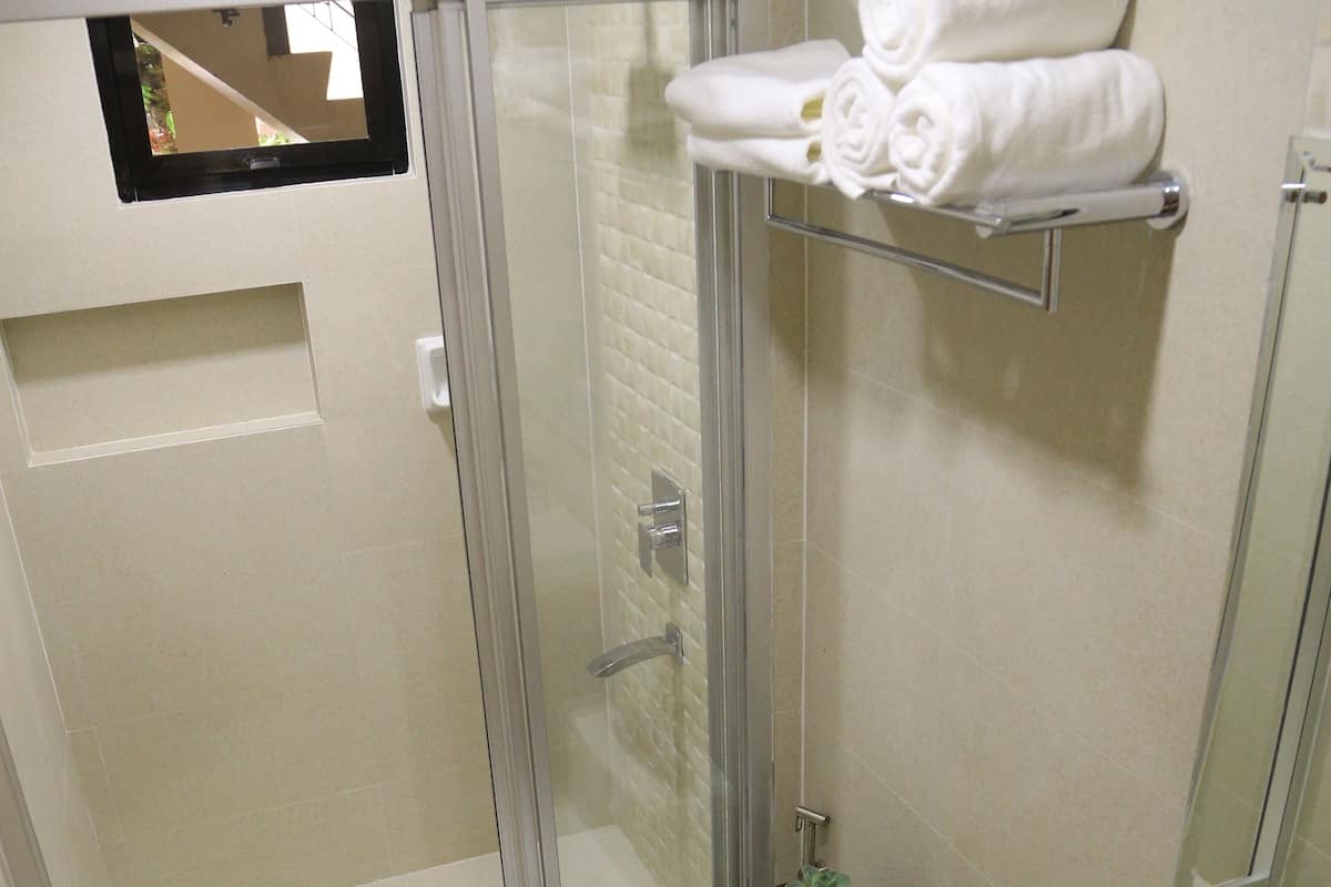 family studio suite | bathroom | shower, free toiletries, slippers, bidet