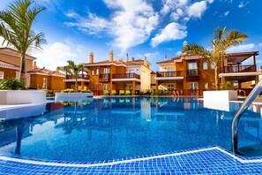 Outdoor pool, open 8 AM to 10 PM, pool umbrellas, sun loungers