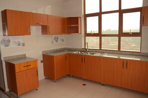 Executive Suite, 1 King Bed | Private kitchenette | Coffee/tea maker, electric kettle - KIM Hotel (Kigali)
