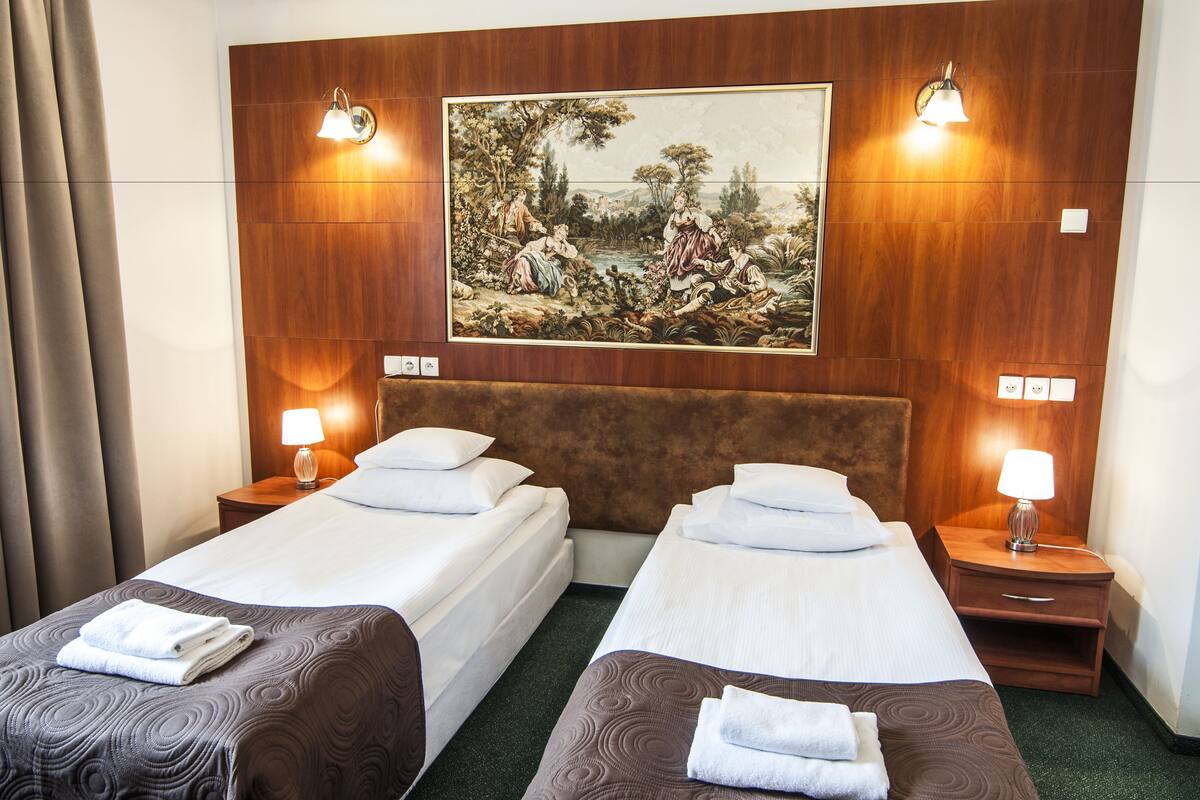 Twin Room | Desk, blackout drapes, iron/ironing board (on request), WiFi (free)