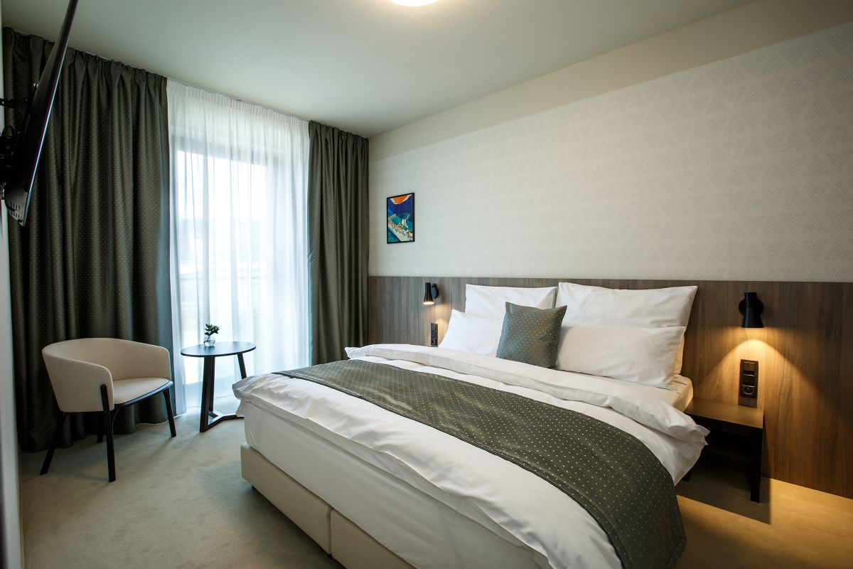 junior suite | 2 bedrooms, premium bedding, minibar, in-room safe