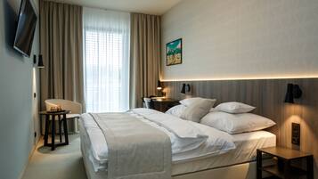 2 habitaciones, ropa de cama de alta calidad y minibar