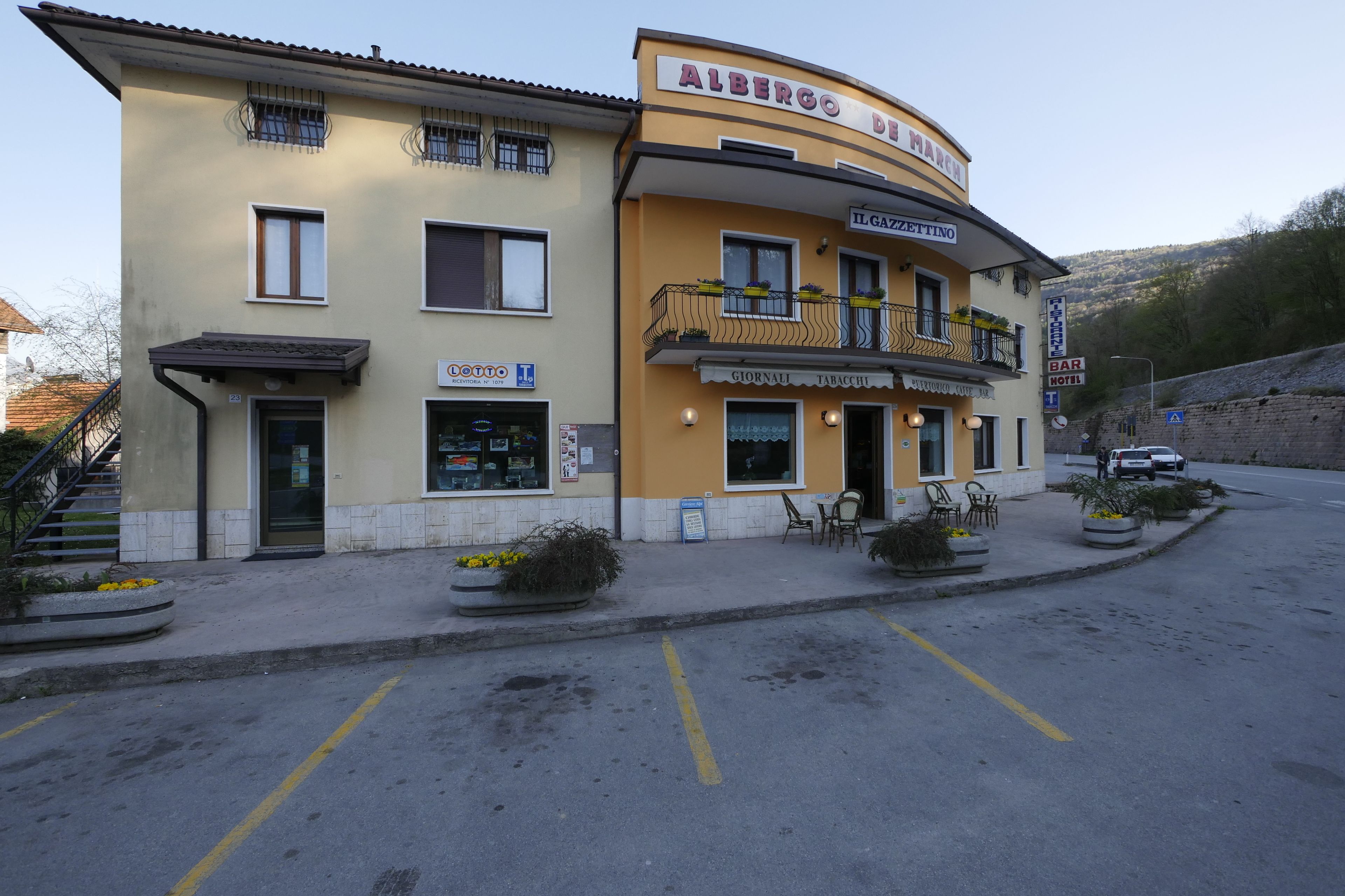 A yellow building with a sign reading "Albergo del March".