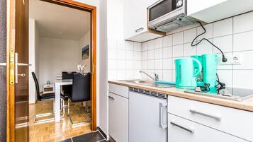 Apartment (HR114-M01) | Private kitchen | Fridge, stovetop, coffee/tea maker, cookware/dishes/utensils