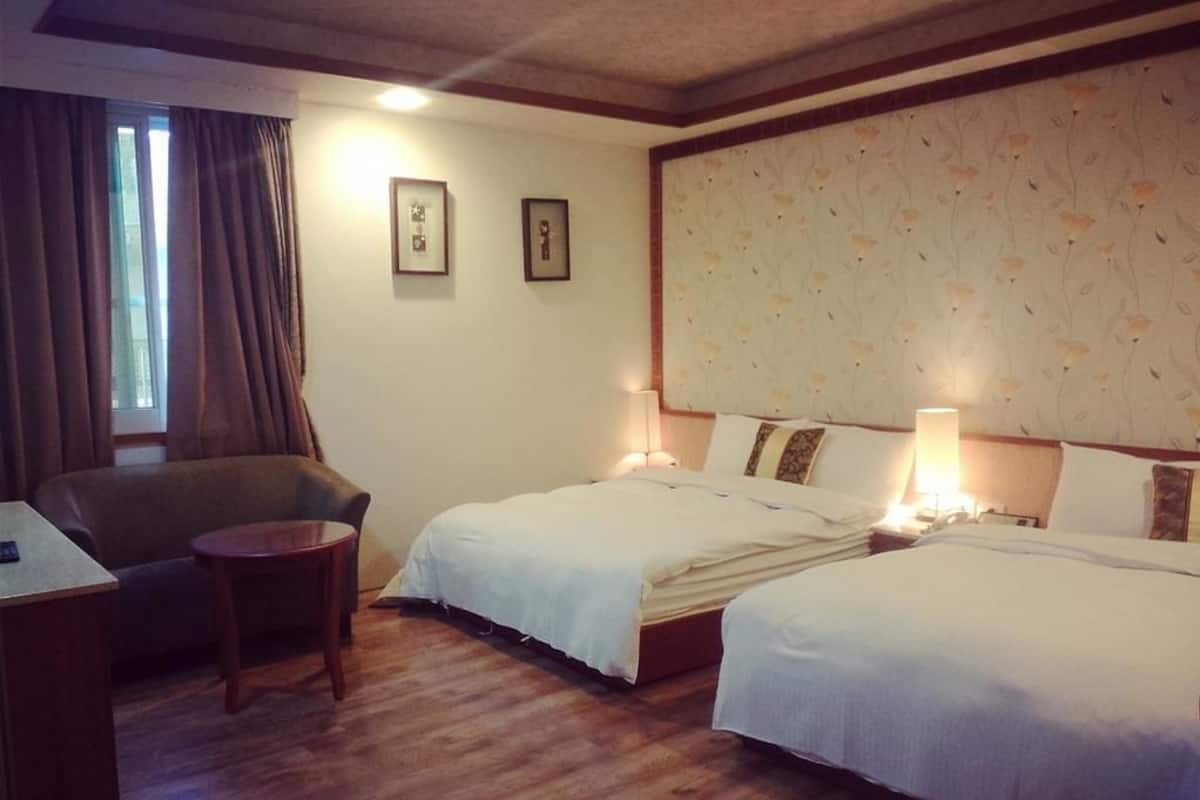 Standard Quadruple Room | Down comforters, blackout drapes, free WiFi, bed sheets