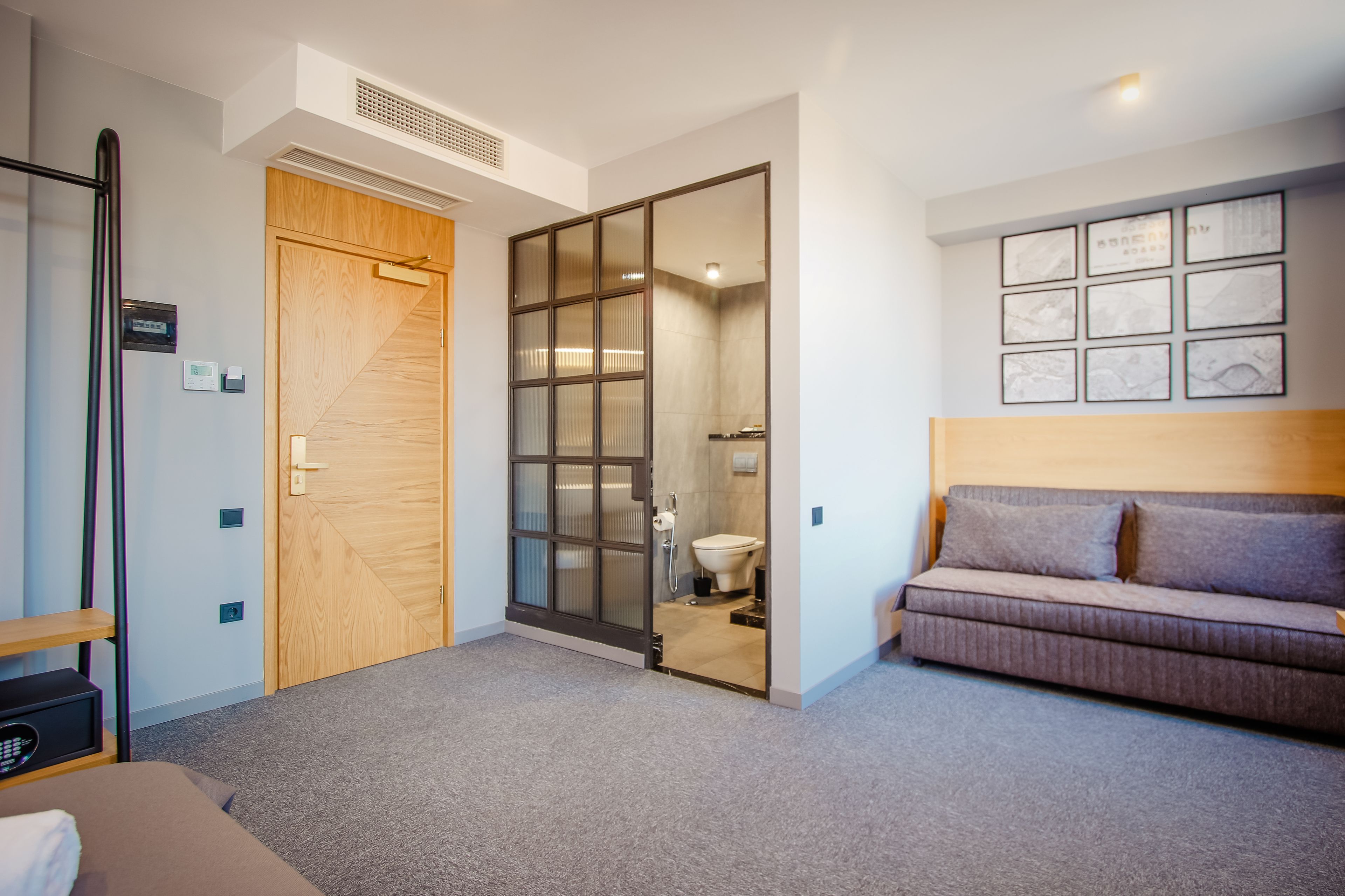 standard quadruple room (with sofa) | living area | flat-screen tv