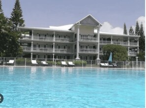 Seasonal outdoor pool, pool umbrellas, pool loungers
