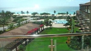 A resort with a pool, beach, and ocean view. - Luxury, Eagle Beach Front 2BR, Penthouse  Private Roof Terrace (Eagle Beach)