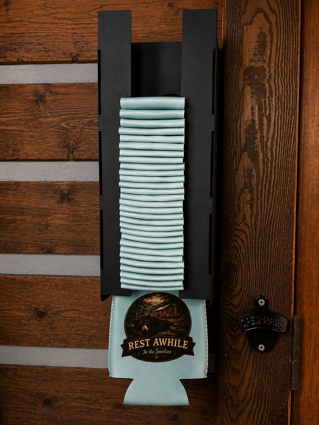 A wooden door with a black handle and a metal latch.