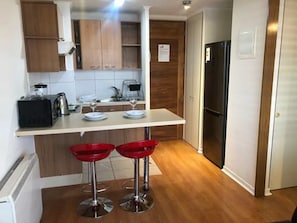 Family Apartment, 1 Queen Bed, Private Bathroom | In-room dining