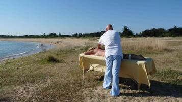 Relax and rejuvenate with a soothing massage on the beach.