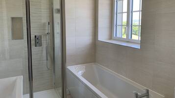 Bathtub, hair dryer, towels, soap