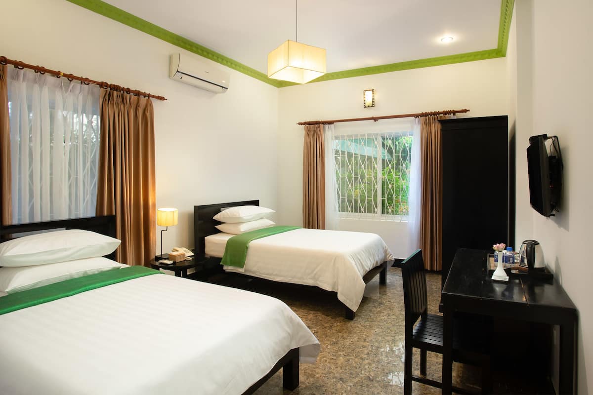 Deluxe Twin Room | Minibar, blackout drapes, soundproofing, free WiFi
