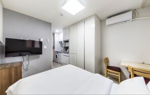 Chambre Deluxe, non-fumeurs | Coin séjour | Télévision à écran plat, chauffage par le sol