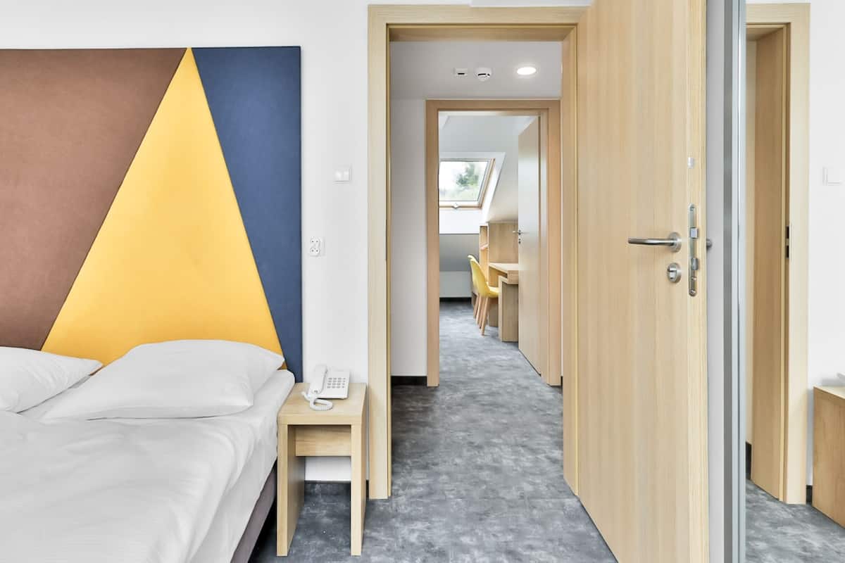 Quadruple Room, Multiple Beds, Non Smoking | In-room safe, desk, laptop workspace, iron/ironing board