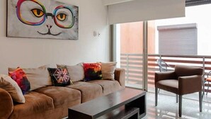 Apartment, 2 Bedrooms | Living room | Flat-screen TV - Infinito 205 by Praia (Playa del Carmen)