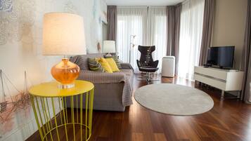 Apartment, 1 Bedroom, Balcony | Living room | Flat-screen TV