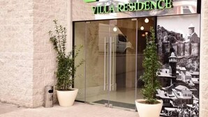 A hotel entrance with a sign reading "HOTEL VILLA RESIDENCE". - Villa Residence Hotel (Tbilisi)