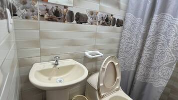 Family Quadruple Room, Multiple Beds, Private Bathroom (Jazmin) | Bathroom | Shower, hair dryer, towels