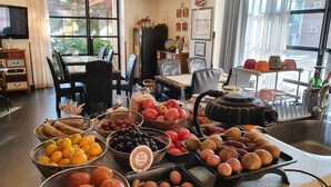 A breakfast buffet with various fruits, vegetables, and baked goods. - Namyangju Bukhangang Dolce Casa Hotel (Namyangju)